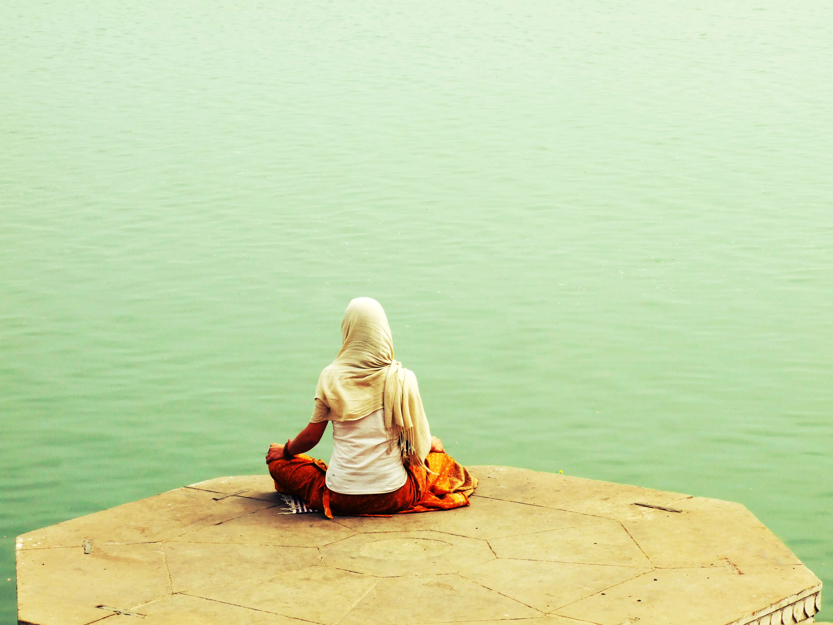 A_Hindu_along_river_Ganges_in_Varanasi,_in_yoga_asana_meditation